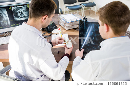 Doctors team having medical council in hospital. Discussing medical issues 136861833