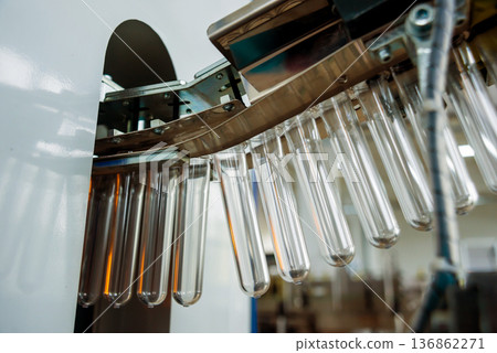 The plastic bottle blowing machine. PET preforms for blowing of plastic bottles The plastic bottle blowing machine. PET preforms for blowing of plastic bottles 136862271