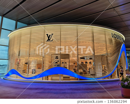 SINGAPORE - NOVEMBER 18, 2025: Louis Vuitton brand retail shop in the large shopping mall SINGAPORE - NOVEMBER 18, 2025: Louis Vuitton brand retail shop in the large shopping mall 136862294