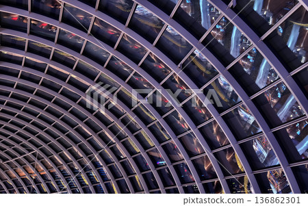 Glass canopy showcasing repeating geometric frames and day light Glass canopy showcasing repeating geometric frames and day light 136862301