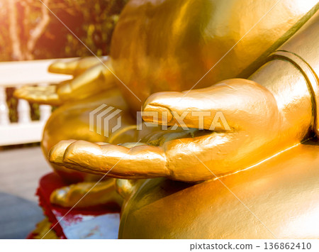 Symbols of Buddhism. Hands of buddist statues. South-Eastern Asia.  136862410
