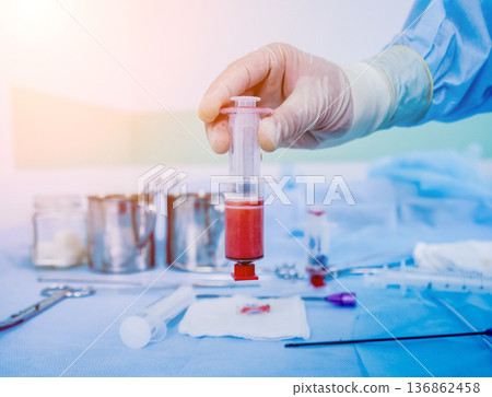 Platelet-Rich plasma preparation. Plasma in syringe. Centrifuge. Platelet-Rich plasma preparation. Plasma in syringe. Centrifuge. 136862458
