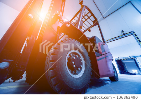 Forklift in a large industrial freezer warehouse. Empty warehouse Forklift in a large industrial freezer warehouse. Empty warehouse 136862490