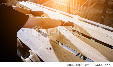 Carpenter with fibreboards at furniture factory workshop. Woodworking industry Carpenter with fibreboards at furniture factory workshop. Woodworking industry 136862567