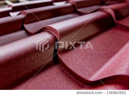 Red metallic roof tiles background with drops of water. 136862602