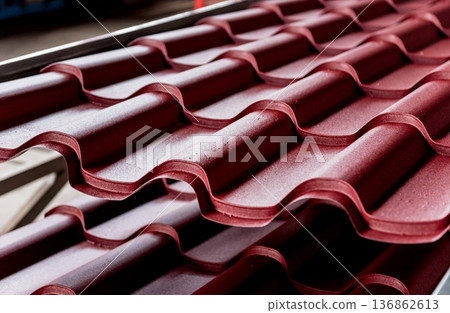 Red metallic roof tiles background with drops of water. 136862613