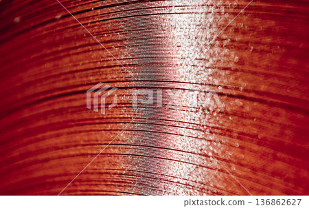 Curved lines of rolled metal are made of sheet steel. 136862627