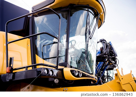 Modern agricultural machinery and equipment. Yellow agricultural harvester. 136862943