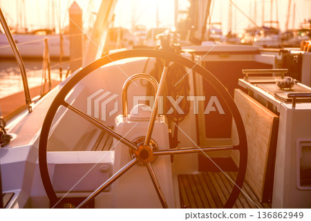 A modern speed boat yacht steering wheels. A modern speed boat yacht steering wheels. 136862949
