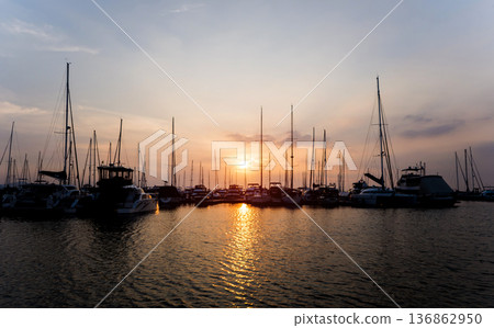 Beautiful view of marina and harbor with yachts and motorboats. Beautiful view of marina and harbor with yachts and motorboats. 136862950