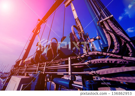 Lifting crane for elevating boat at harbor docks. 136862953