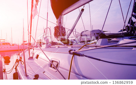 View of harbor with yachts details. Beautiful sunset sky in the marina bay. 136862959