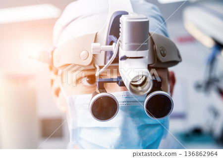 Portrait of spinal surgeon in operating room with surgery equipment. Portrait of spinal surgeon in operating room with surgery equipment. 136862964
