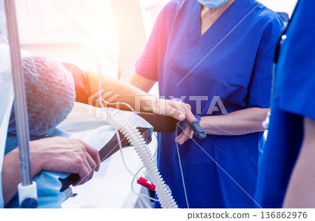 Spinal surgery. Group of surgeons in operating room with surgery equipment. Spinal surgery. Group of surgeons in operating room with surgery equipment. 136862976