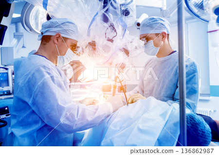 Spinal surgery. Group of surgeons in operating room with surgery equipment. Spinal surgery. Group of surgeons in operating room with surgery equipment. 136862987