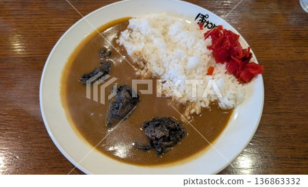 Coffee shop curry rice served on a single plate with curry roux and white rice 136863332