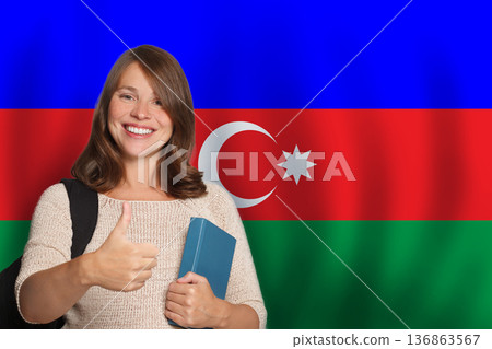 Cute woman student against Azeri flag background. Travel, education and learn language 136863567