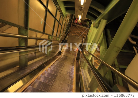Long escalators in Hong Kong Upward escalators connecting the night streets 136863772