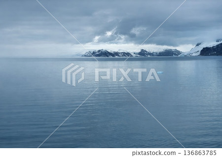 Minimal arctic seascape with floating ice and dramatic sky, panoramic natural background Minimal arctic seascape with floating ice and dramatic sky, panoramic natural background 136863785