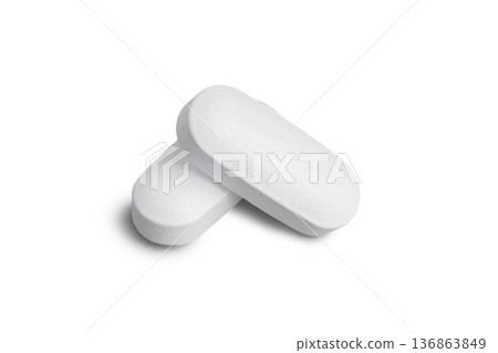 Macro of two white tablets, medicine pill capsules, supplement, vitamin isolated on white background Macro of two white tablets, medicine pill capsules, supplement, vitamin isolated on white background 136863849