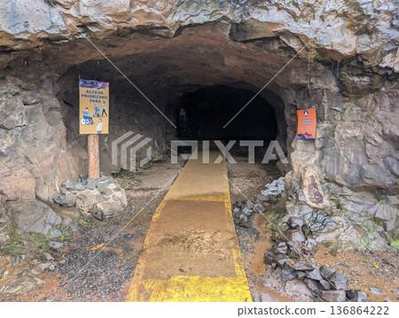 Misiones, Argentina - June 23, 2025: Minera Wanda or the Wanda Mines, in Misiones, Argentina. A close-up of the tunnel entrance. Misiones, Argentina - June 23, 2025: Minera Wanda or the Wanda Mines, in Misiones, Argentina. A close-up of the tunnel entrance. 136864222