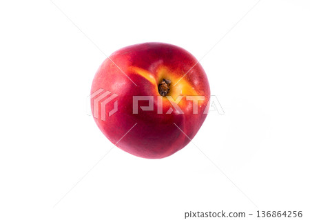 one whole peach on a white background in isolation 136864256