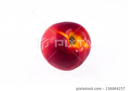 one whole peach on a white background in isolation 136864257