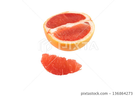 Grapefruit sliced into pieces on a white background in isolation Grapefruit sliced into pieces on a white background in isolation 136864273