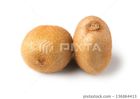 Two whole Kiwi lie on a white background in isolation Two whole Kiwi lie on a white background in isolation 136864413