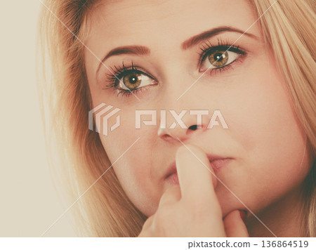 Attractive blonde woman thinking and contemplating 136864519
