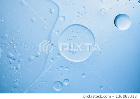 Abstract background of blue liquid with oil and water separating Abstract background of blue liquid with oil and water separating 136865318
