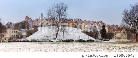 Winter Panorama Of Warsaw Old Town Skyline Above Snow Covered Vistula River Embankment 136865645