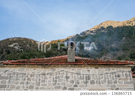 House Roof with Chimney and Smoke 136865715