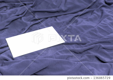 Stylish dusty blue cloth with blank card. Stylish dusty blue cloth with blank card. 136865729