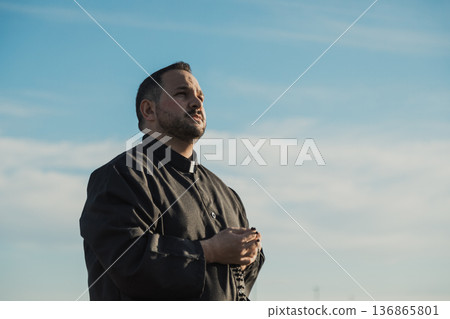 Spiritual Priest Looking At God In The Sky Spiritual Priest Looking At God In The Sky 136865801
