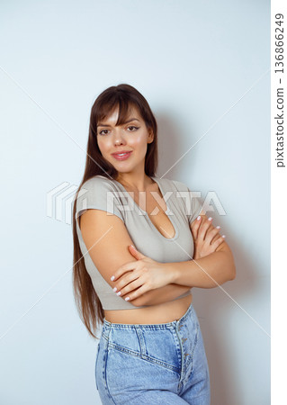 Confident Young Woman with Arms Crossed Confident Young Woman with Arms Crossed 136866249