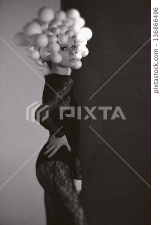 Fashion model posing in black lace avant-garde outfit Fashion model posing in black lace avant-garde outfit 136866496