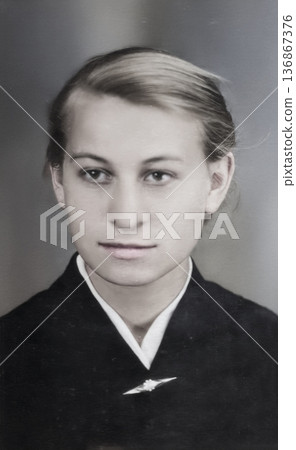 Vintage portrait of a beautiful young girl with a stylish hairstyle from the 1950s. Retro photo, 1958. Vintage portrait of a beautiful young girl with a stylish hairstyle from the 1950s. Retro photo, 1958. 136867376