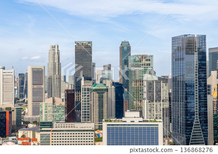 Urban downtown district cityscape featuring high rise commercial buildings and corporate architecture in Singapore CBD Urban downtown district cityscape featuring high rise commercial buildings and corporate architecture in Singapore CBD 136868276