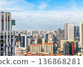 Modern business district skyline with steel and glass skyscrapers rising above the dense metropolitan landscape, Singapore 136868281