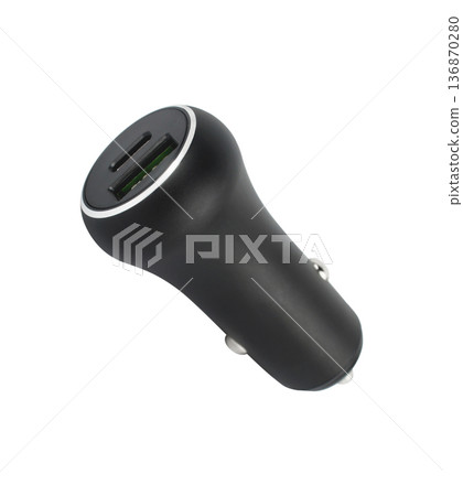 charger for the phone in the car from the cigarette lighter, on a white background charger for the phone in the car from the cigarette lighter, on a white background 136870280