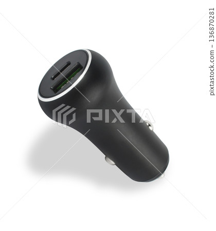 charger for the phone in the car from the cigarette lighter, on a white background charger for the phone in the car from the cigarette lighter, on a white background 136870281
