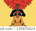 Afro Couple with hearts in background shares a moment of love during a fun celebration in a bright setting 136870424