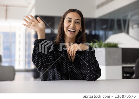 Cheerful young Middle Eastern business influencer woman giving webinar Cheerful young Middle Eastern business influencer woman giving webinar 136870570