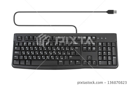 keyboard for a computer, wired with a wire and a connection plug, on a white background isolated keyboard for a computer, wired with a wire and a connection plug, on a white background isolated 136870823