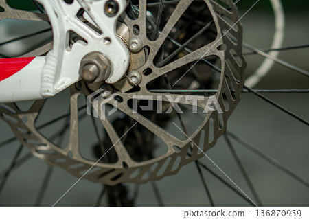 Rotor, brake disk on a bicycle wheel, close up 136870959