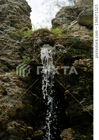 A waterfall, a fall of water originating from rock A waterfall, a fall of water originating from rock 136871323