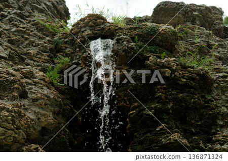 A waterfall, a fall of water originating from rock A waterfall, a fall of water originating from rock 136871324
