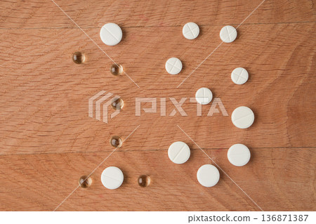 Number nineteen laid out from tablets of various shapes on a wooden board background 136871387