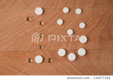 Number nineteen laid out from tablets of various shapes on a wooden board background Number nineteen laid out from tablets of various shapes on a wooden board background 136871388